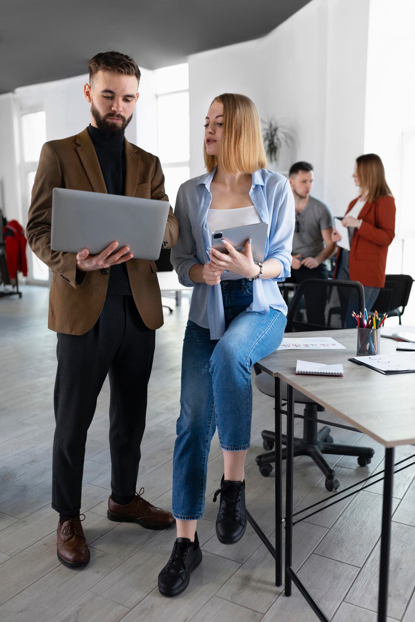 Two people verifying data in a professional setting
